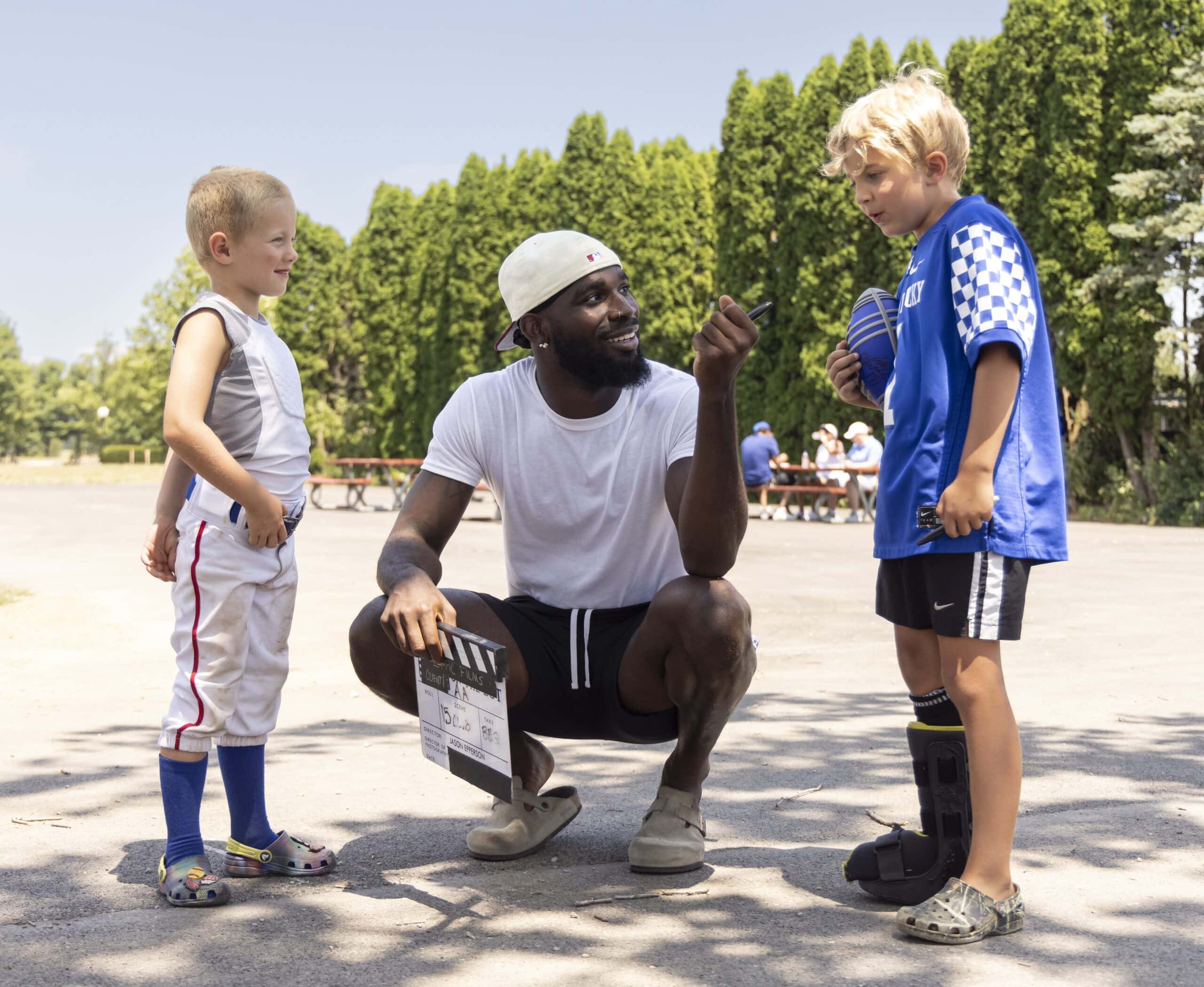 Blog Pic 4 Kentucky Football Player interviewing two little boys wearing UK gear