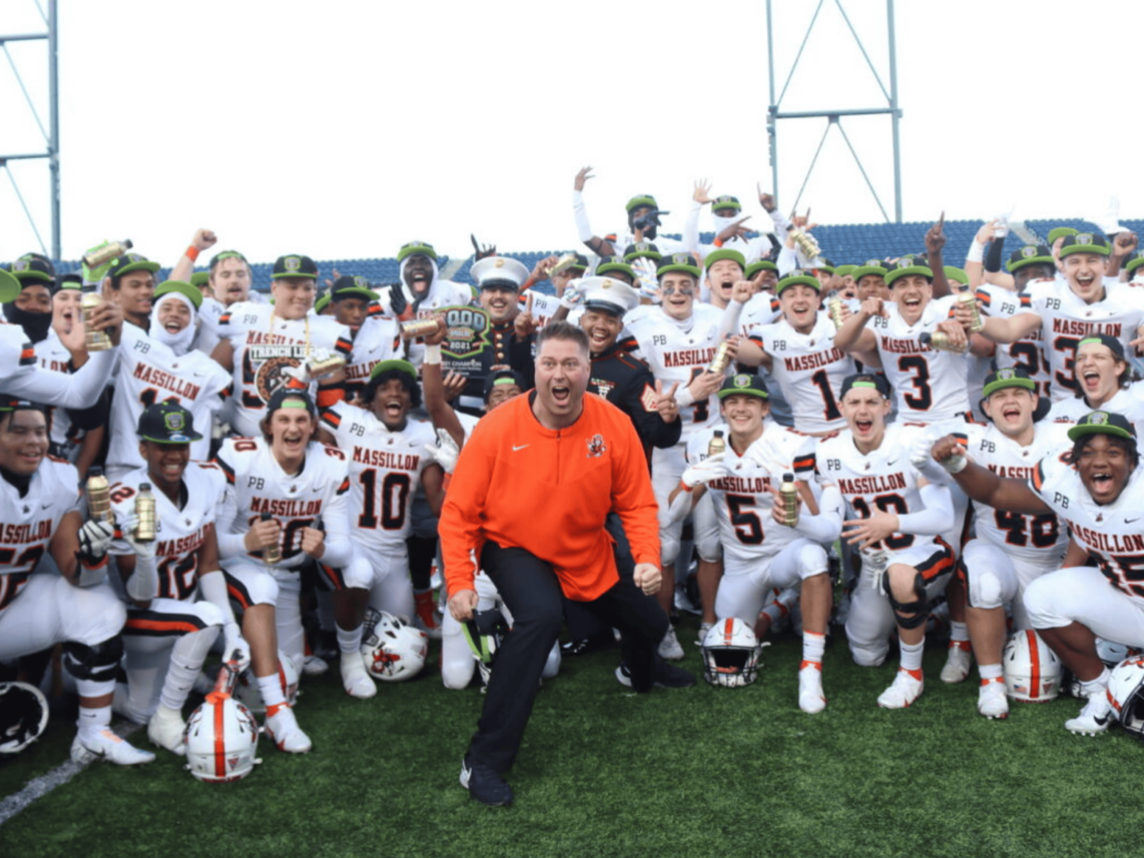 Football team and coach excited about their win